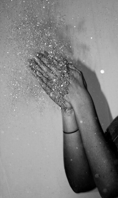 Inspirational image featuring a person clapping with glitter, conveying a sense of celebration, success, and the sparkling moments that The Aesthetic Edit aims to create for female entrepreneurs and their brands through impactful marketing.
