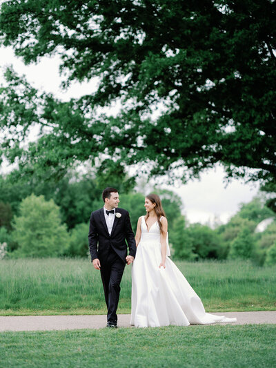 Bride and Groom walking together at Congressional Country Club in Bethesda, Maryland.