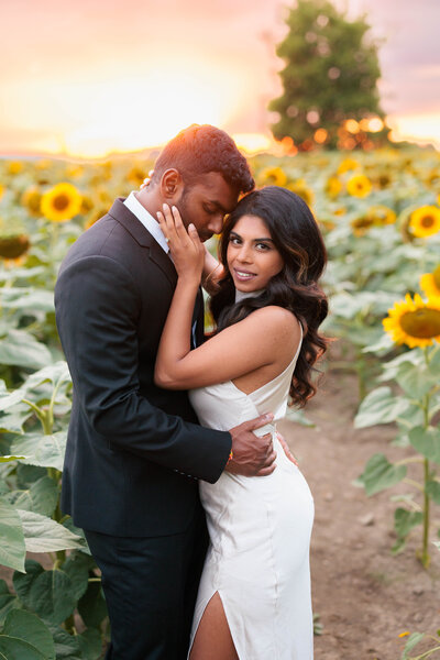 Groom holding bride