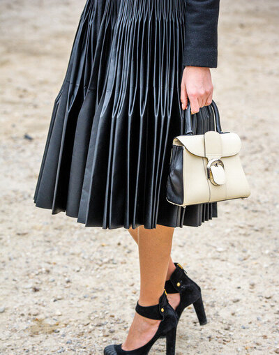 fashionable woman wearing a leather skirt