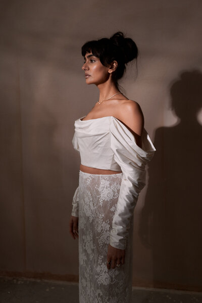 Corset silk top worn by bride styled by British wedding dress designer