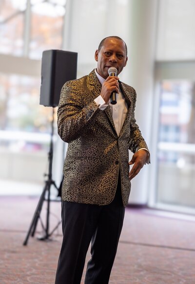 a man speaking at an event