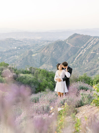 Beautiful bride and groom outdoors with mountain view