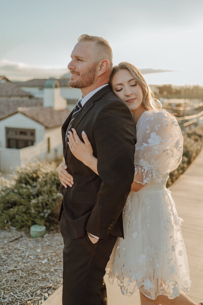 Boho bride petting horse taken by Orange County wedding photographer Mikey Mora Photography