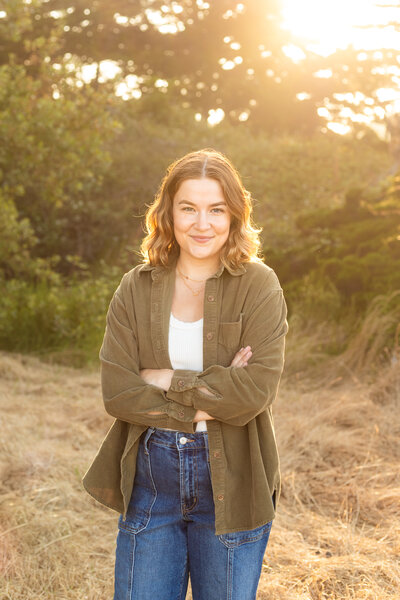 person smiling with their arms crossed in santa cruz