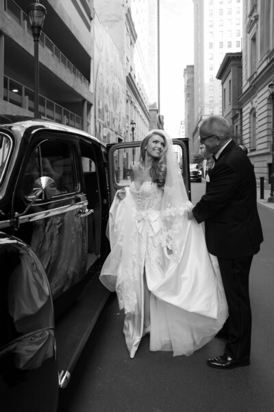 Emotional candid moment of father giving away the bride during a church wedding ceremony in Philadelphia