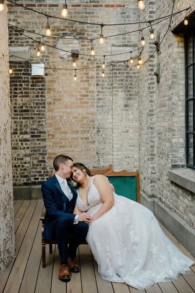 A bride and groom at The New Vintage Place with a wedding photographer in Grand Rapids