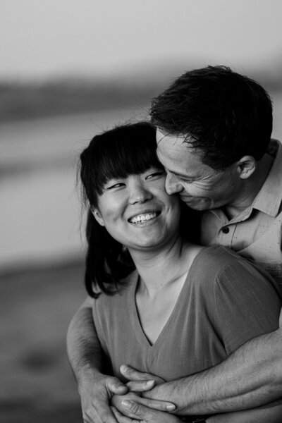 A husband holding his wife snuggling in - heartfully captured
