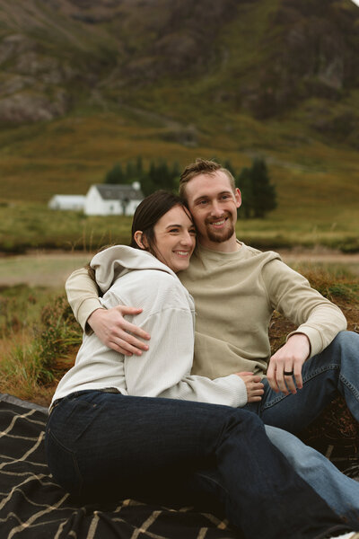 couple on honeymoon smile together as they think about their future
