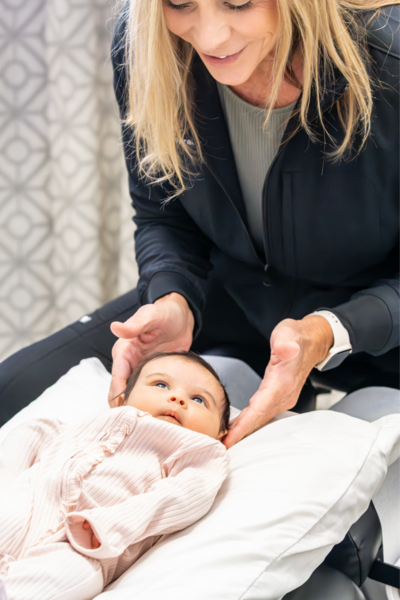 Dr. Tori adjusting a baby
