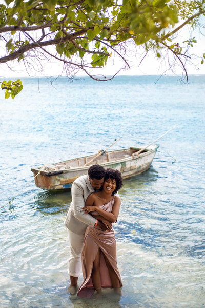 Couple hug in Jamaica for engagement photos