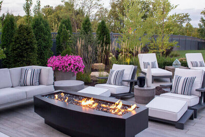 Curved liner concrete floating fire pit with electric push button start in carbon color