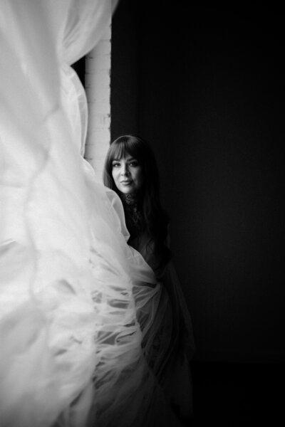 black and white image  woman  tossing dress