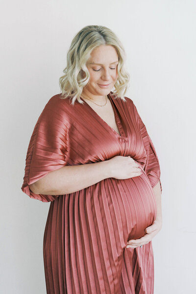 pregnant mom holding belly during maternity session