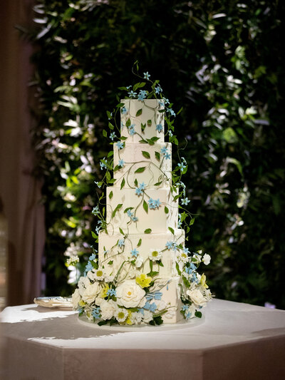 A beautifully decorated wedding venue with elegant floral arrangements and ambient lighting, exemplifying Bliss Events' attention to detail.