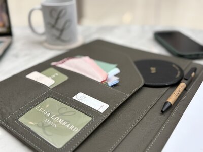 A binder full of business cards and colour swatches.