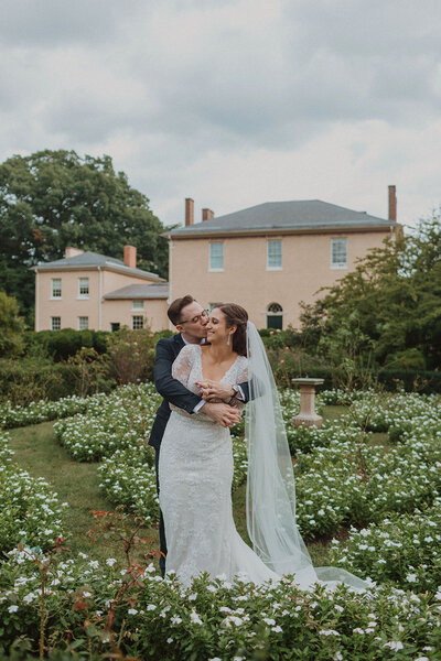 Bride and Groom pose in courtyard garden at Tudor Place in DC