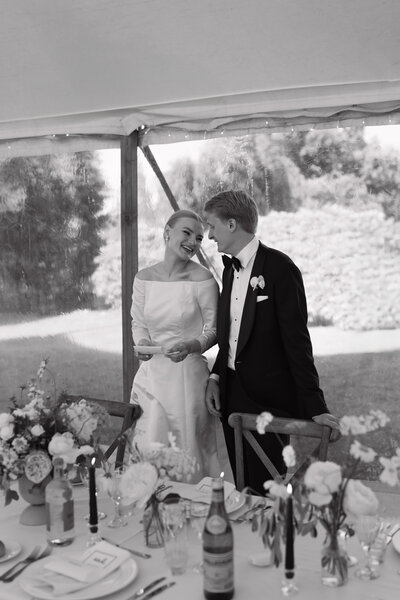 Wedding photographer captures couple taking a stroll hand in hand at their french chateau wedding.