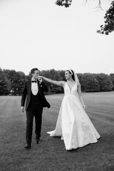 a wedding couple embracing at their wedding in ireland at adare manor