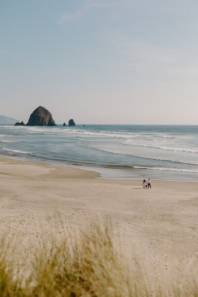 Engagement session on Cannon Beach featuring haystack rock.