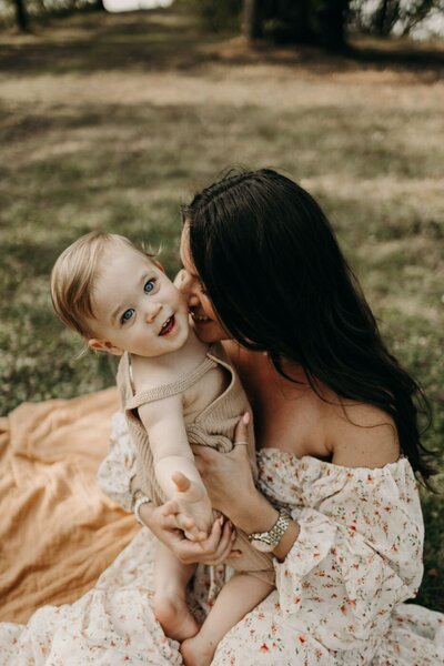 Tender moment between a mother and her blue-eyed baby captured during a Mullingar photography session