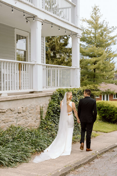 A couple standing outside of their hotel in Niagara on the Lake