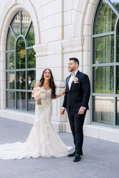 bride and groom laughing