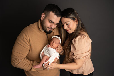 family posing during newborn photos in Murrieta, CA