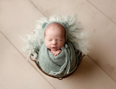 wrapped baby newborn photo session in loveland studio