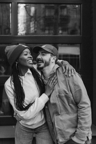 black and white of interracial couple smiling