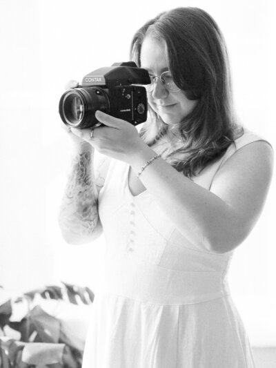 Portrait of Kaytlyn Rei, an editorial wedding photographer serving Virginia and beyond.