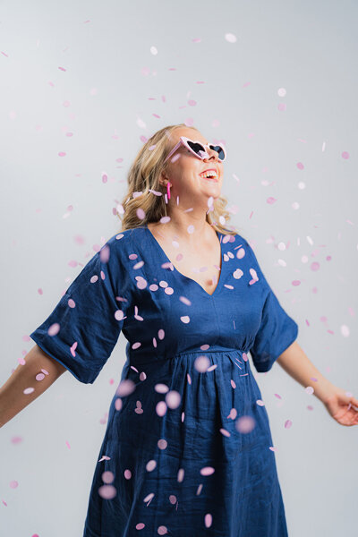 Amy Hart the Business System Consultant dancing in confetti