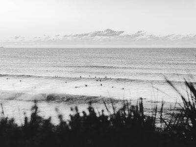 Beach with waves and surfers