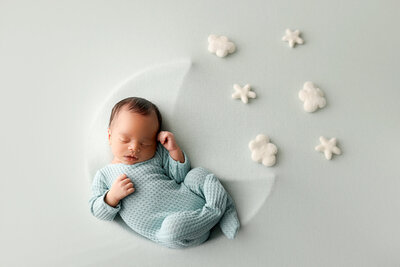Safe newborn photoshoot capturing a sleeping baby