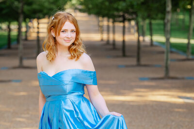 Allie in blue princess dress in Gateway Arch park