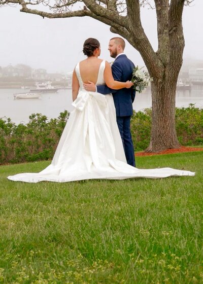 Bride and groom standing outside Old Whaling Church in Edgartown MA