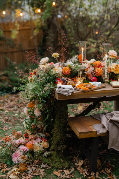 Fall-inspired tablescape with large flower center piece and candles