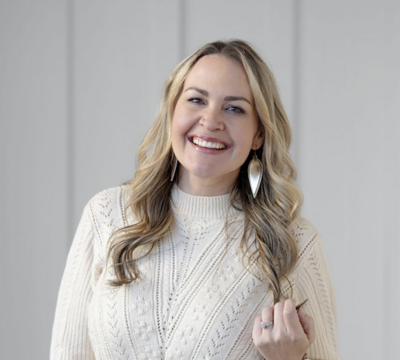 blonde woman smiling at camera