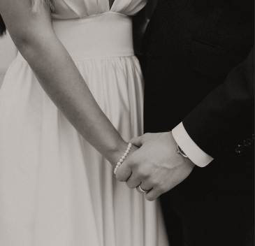 Bride and groom holding hands