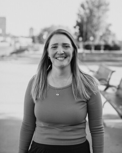Smiling wedding photographer looking directly at the camera.