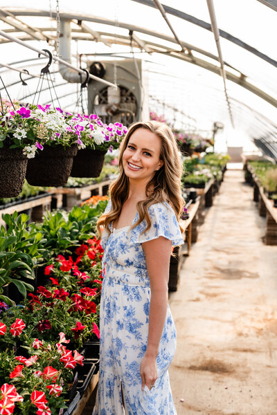 JaCee Petko, Christian life coach, smiling in a greenhouse