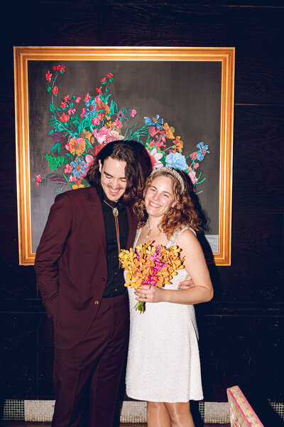 A couple poses at their wedding reception at Carnivale Chicago