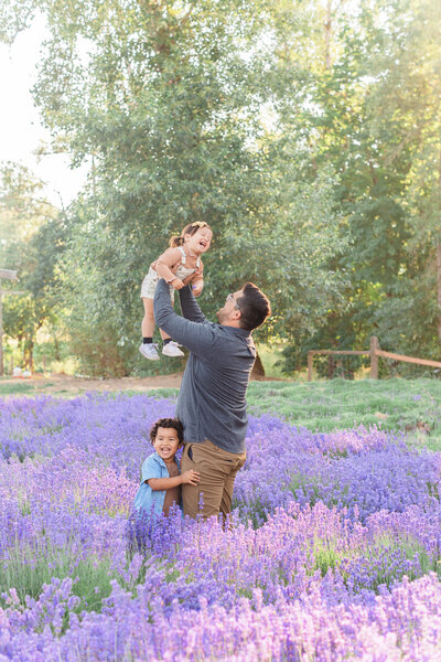 dad and kids playing in lavender field during photos