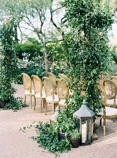 Destination wedding photography capturing the serene beauty of a garden wedding ceremony at a high-end Arizona venue.