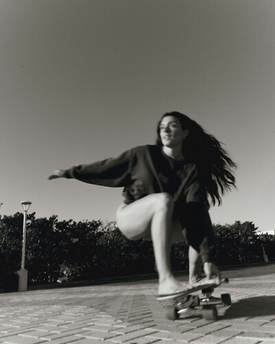 Girl on beach with camera