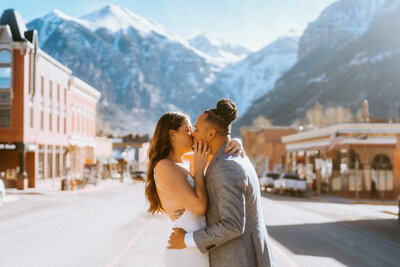 During their summer elopement in Colorado, couple reads vows in front of lake in Telluride