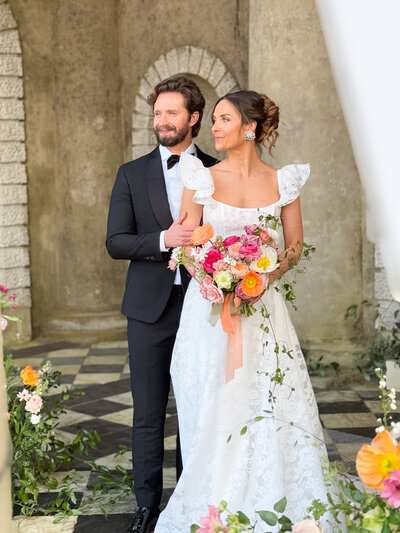 Bride and groom smiling naturally during their wedding photos 