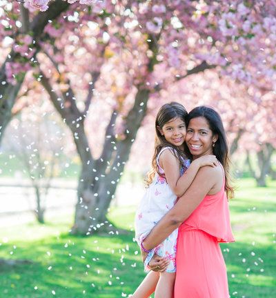 Mother and daughter in Cherry Blossom Trees