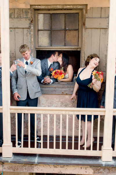 New Orleans wedding couple kissing in window