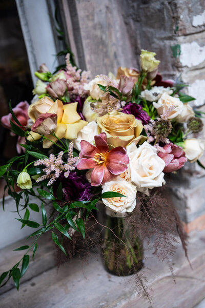New Orleans bridal bouquet resting on window ledge